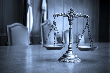 Scales of justice on the conference table of a Camp Pendleton Military Appellate Lawyer